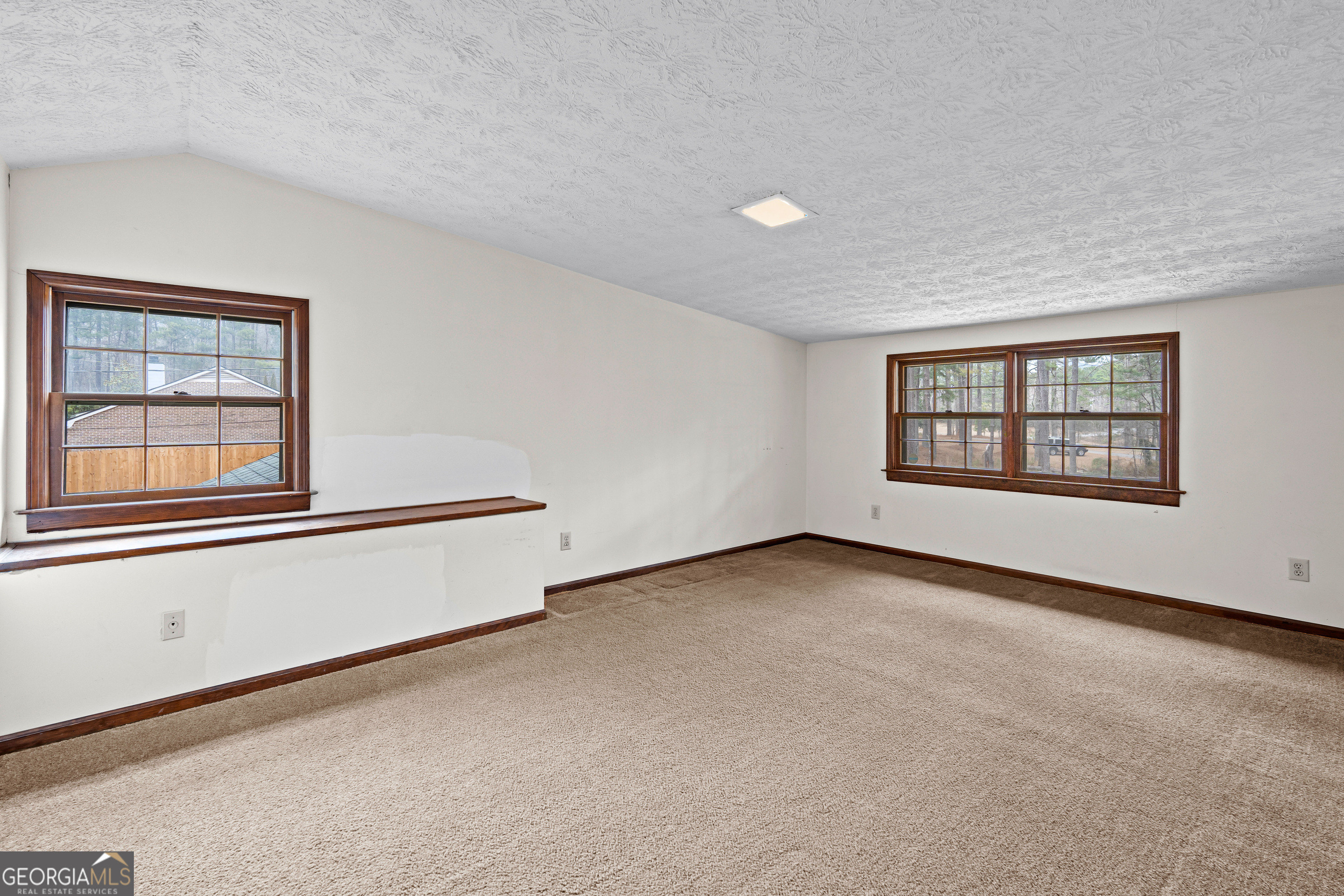447 Adams Road Fayetteville, GA 30214 - Photo 36 of 52 an empty room with windows