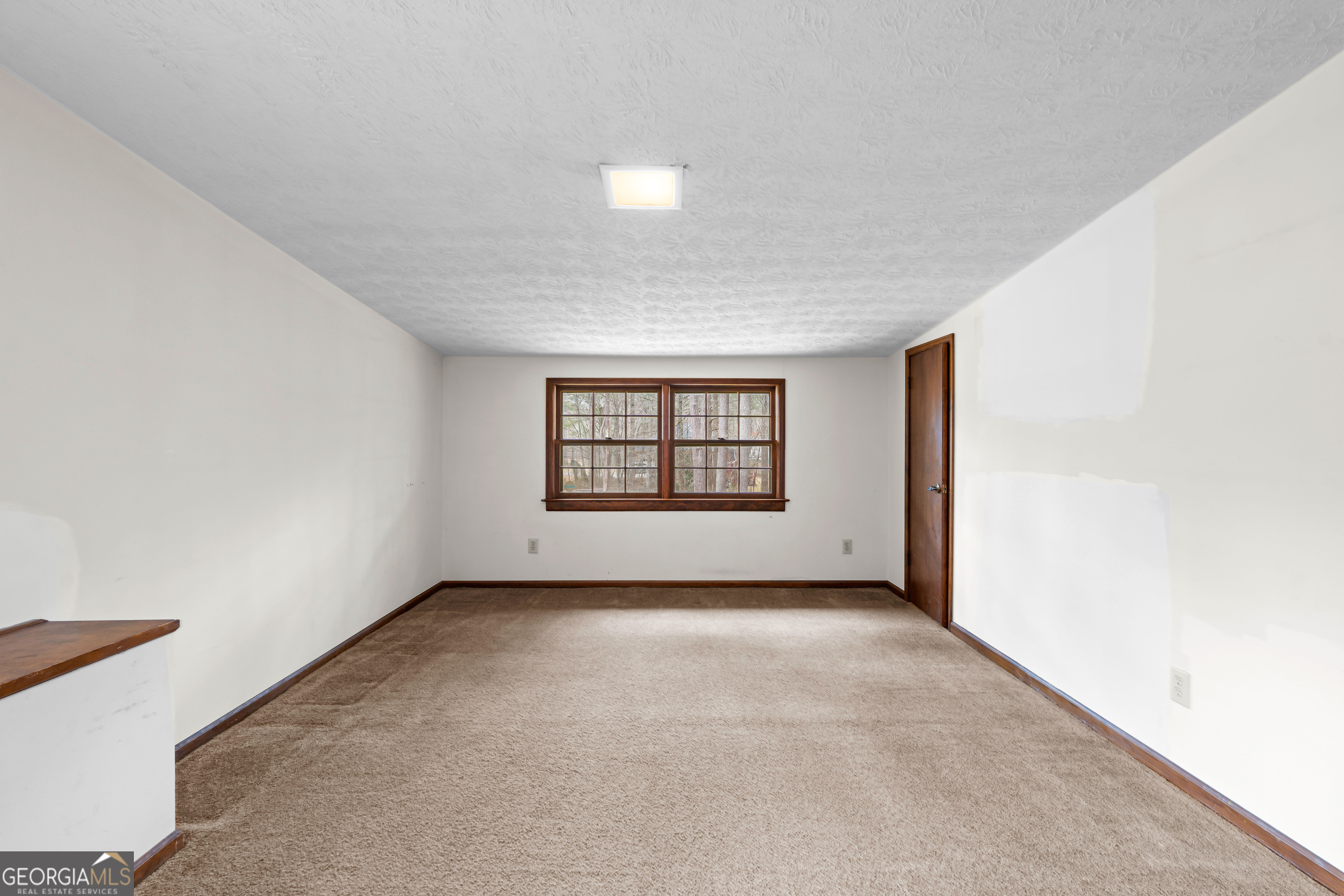447 Adams Road Fayetteville, GA 30214 - Photo 37 of 52 an empty room with windows