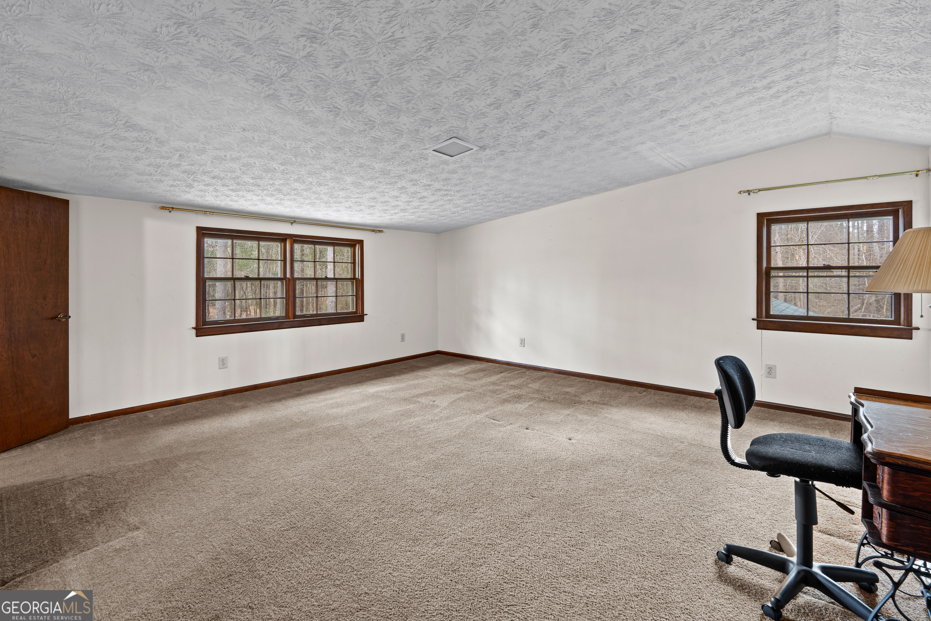 447 Adams Road Fayetteville, GA 30214 - Photo 39 of 52 a view of an empty room with a window