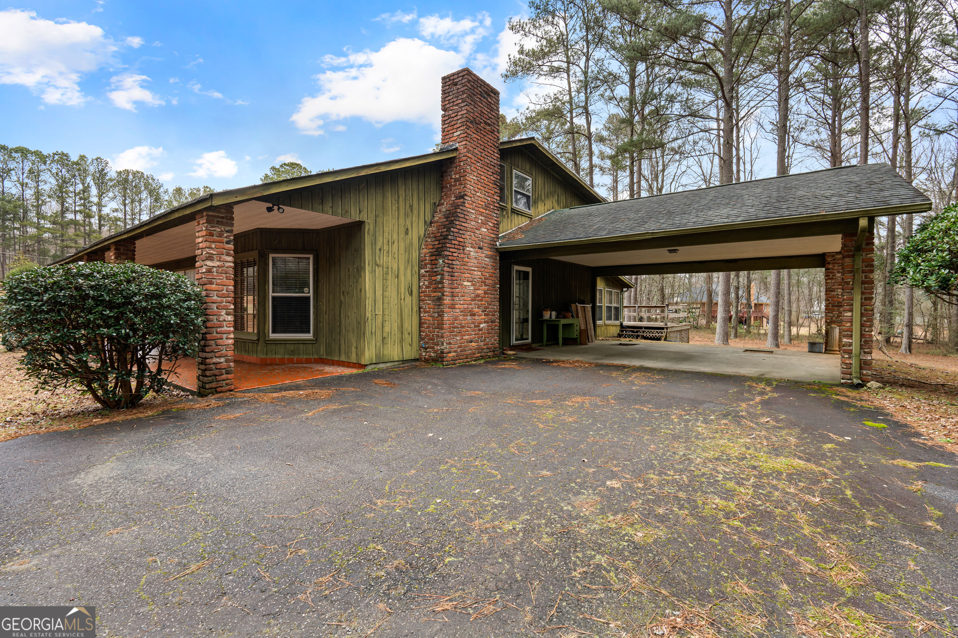447 Adams Road Fayetteville, GA 30214 - Photo 6 of 52 a view of a house with a outdoor space and porch