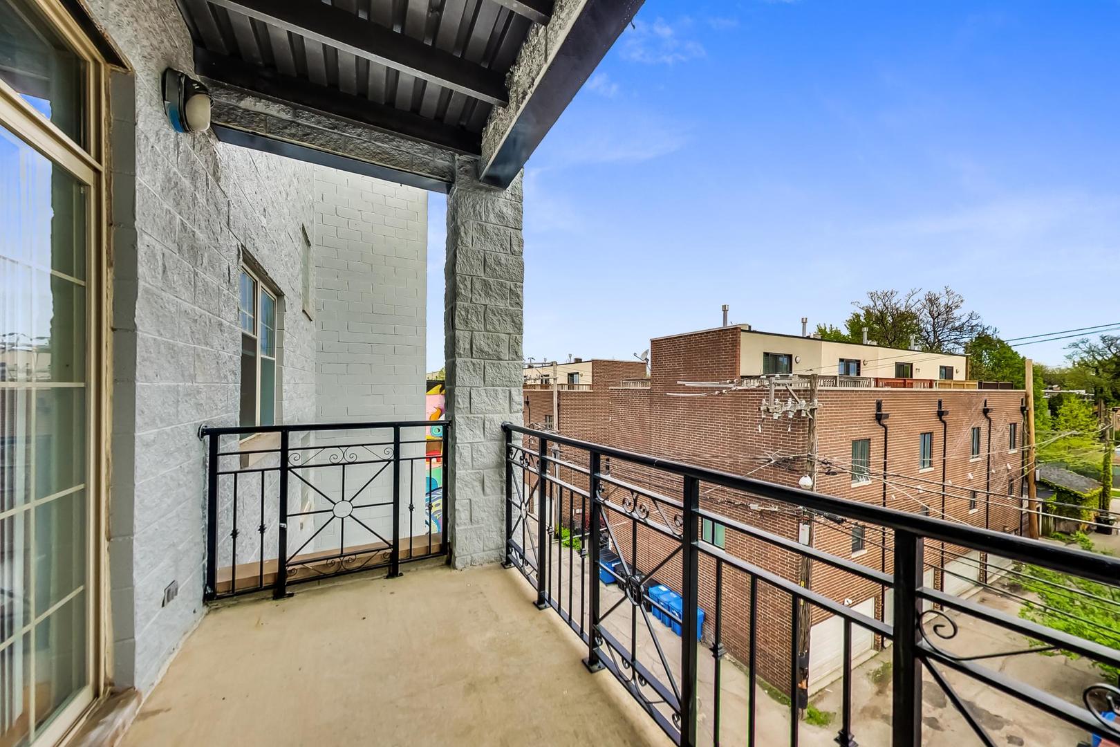 2032 West Division Street, Unit 301N Chicago, IL 60622 - Photo 11 of 12 a view of a balcony with furniture