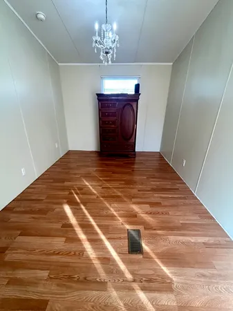 a view of a hallway with a chandelier