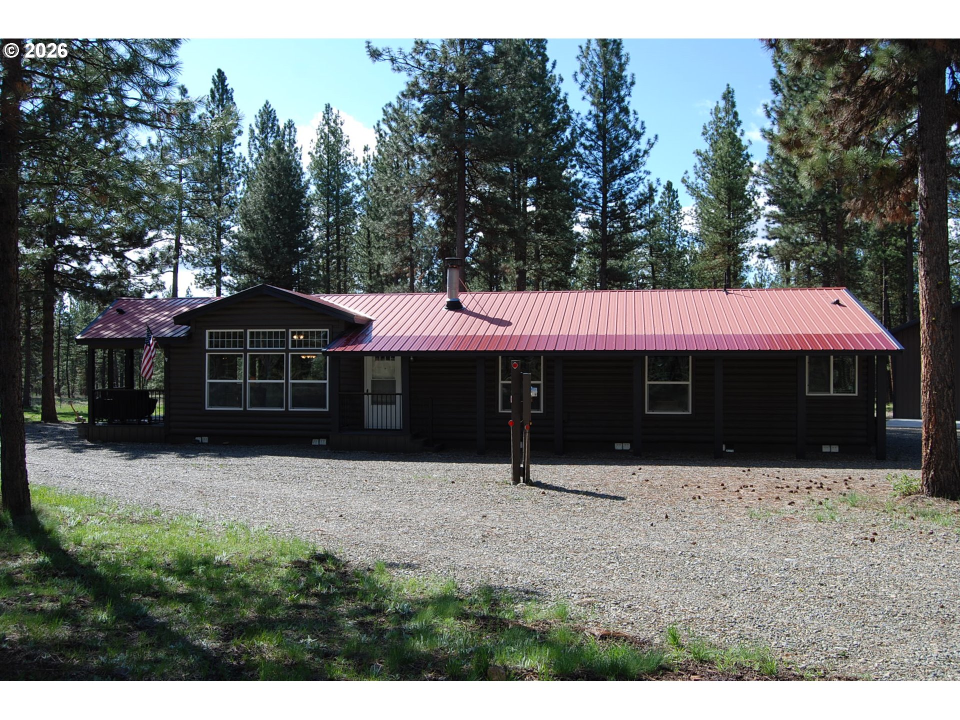 38987 Deer Creek Road Baker City, OR 97814 - Photo 1 of 45 a front view of a house with a yard