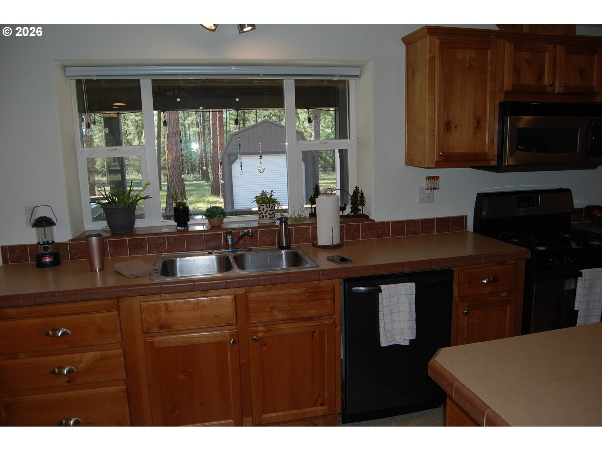 38987 Deer Creek Road Baker City, OR 97814 - Photo 17 of 45 a kitchen with a sink and cabinets