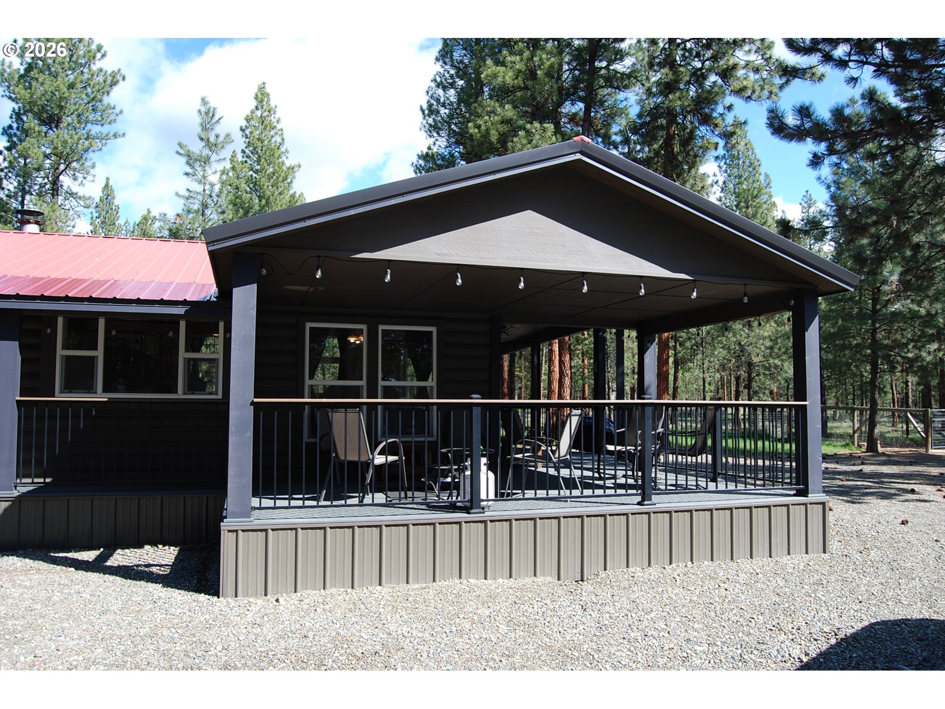 38987 Deer Creek Road Baker City, OR 97814 - Photo 18 of 45 a view of house with large window and wooden fence