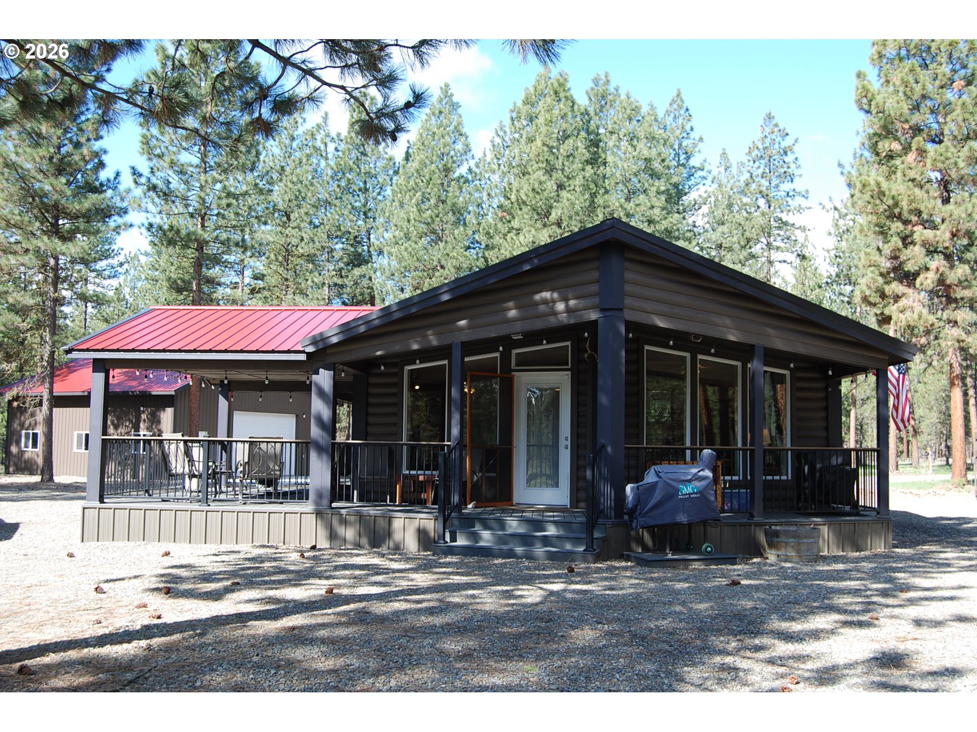 38987 Deer Creek Road Baker City, OR 97814 - Photo 2 of 45 a view of a house with backyard porch and sitting area