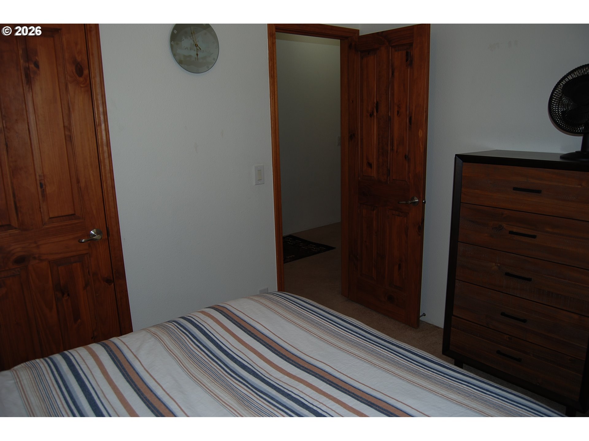 38987 Deer Creek Road Baker City, OR 97814 - Photo 24 of 45 a bedroom with a bed and wooden floor