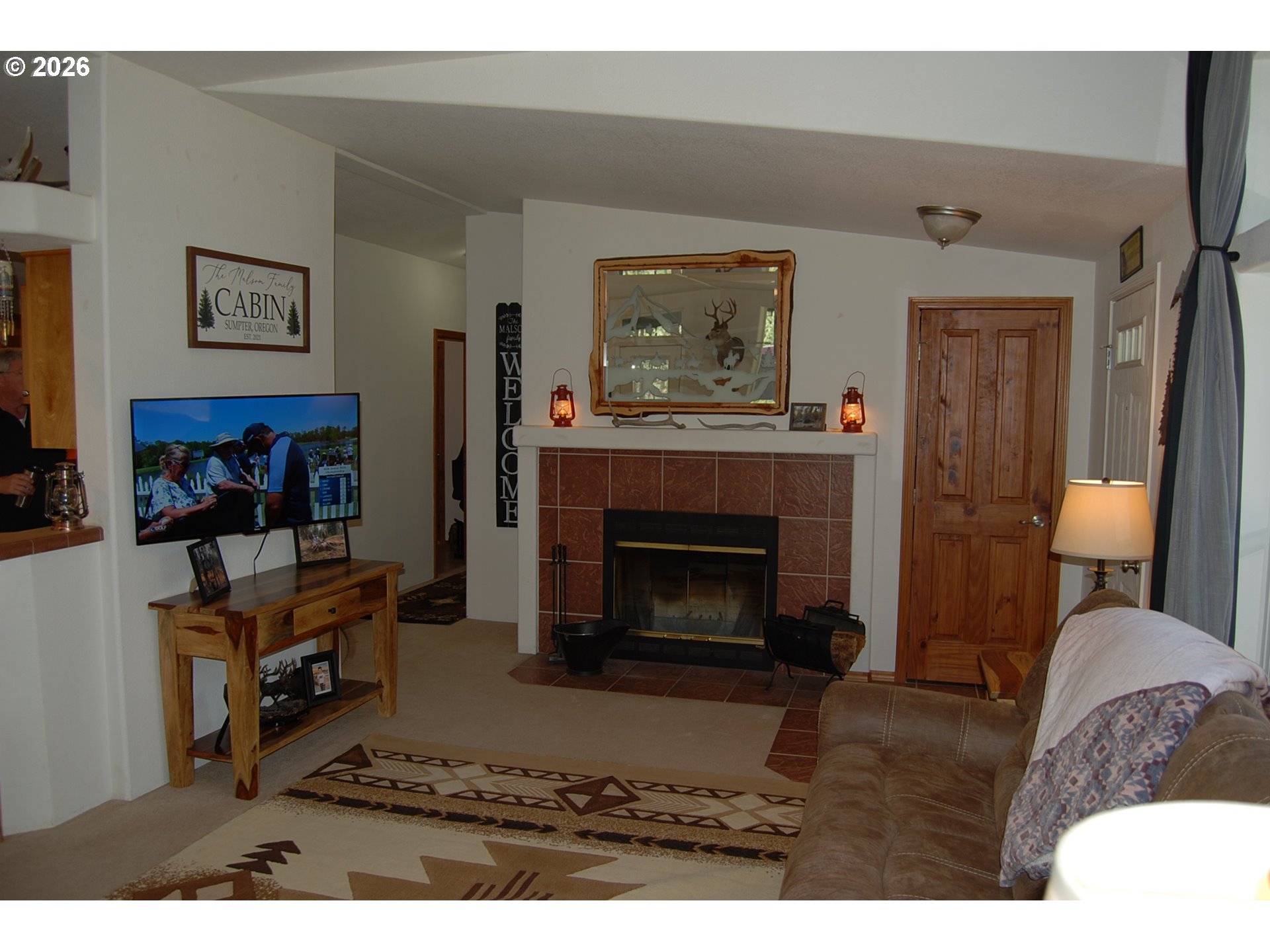 38987 Deer Creek Road Baker City, OR 97814 - Photo 6 of 45 a living room with furniture and a fireplace