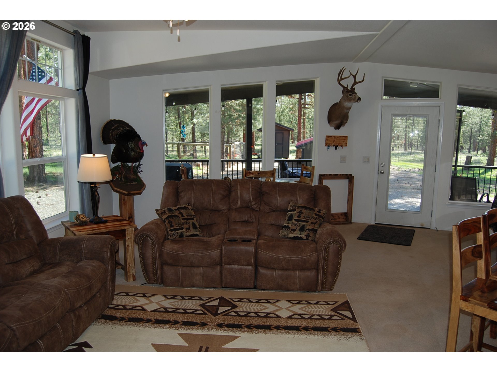 38987 Deer Creek Road Baker City, OR 97814 - Photo 7 of 45 a living room with furniture and a large window