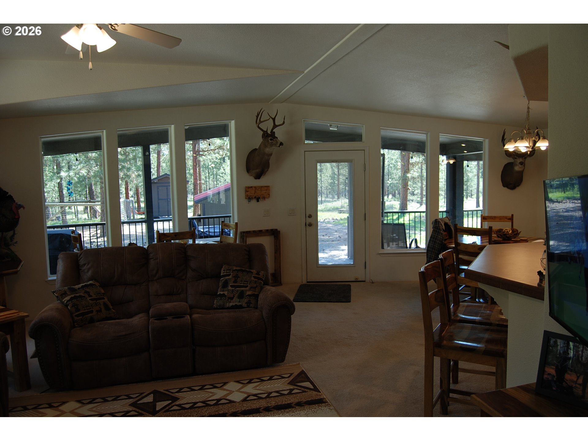 38987 Deer Creek Road Baker City, OR 97814 - Photo 8 of 45 a living room with furniture and a large window
