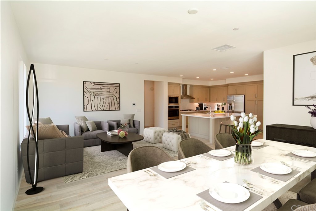 3197 Doheny Way Dana Point, CA 92629 - Photo 10 of 28 a living room with furniture kitchen view and a wooden floor