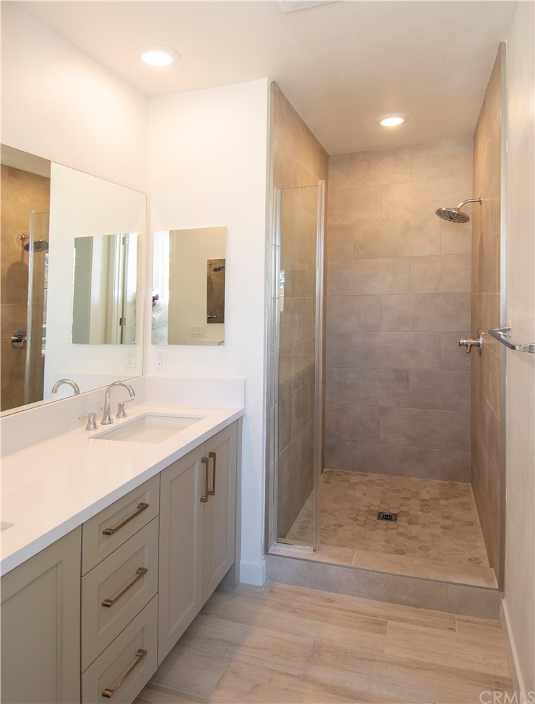 3197 Doheny Way Dana Point, CA 92629 - Photo 14 of 28 a bathroom with a shower sink and mirror