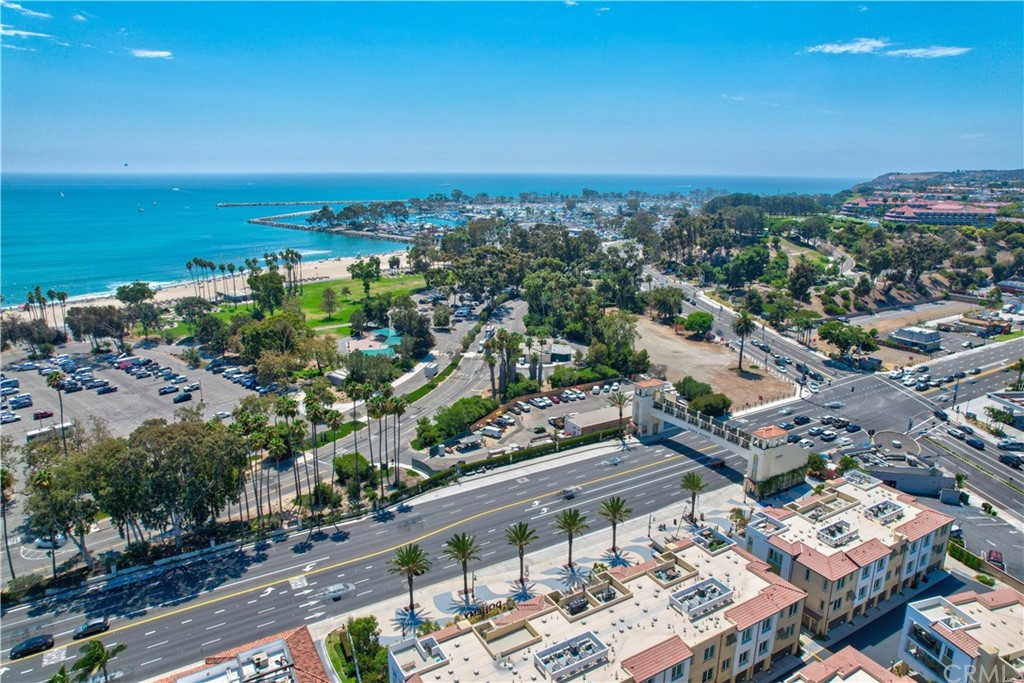 3197 Doheny Way Dana Point, CA 92629 - Photo 22 of 28 an aerial view of a city with lots of residential buildings and ocean view in back