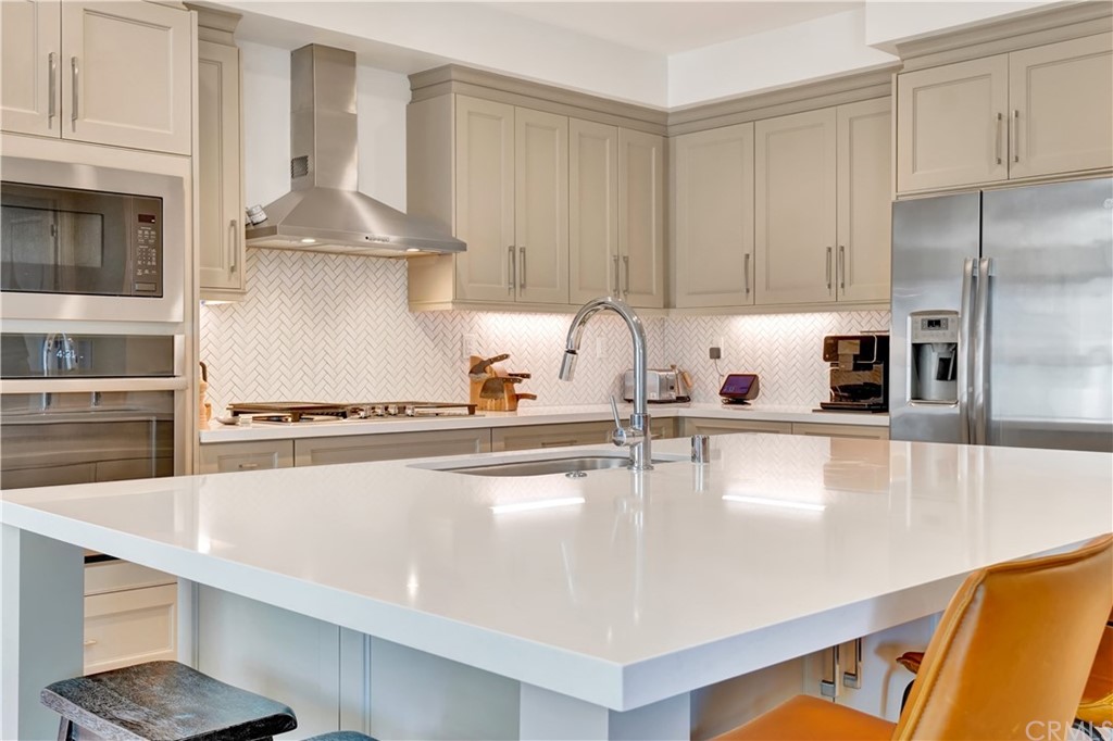 3197 Doheny Way Dana Point, CA 92629 - Photo 5 of 28 a kitchen with stainless steel appliances a sink a stove and a refrigerator