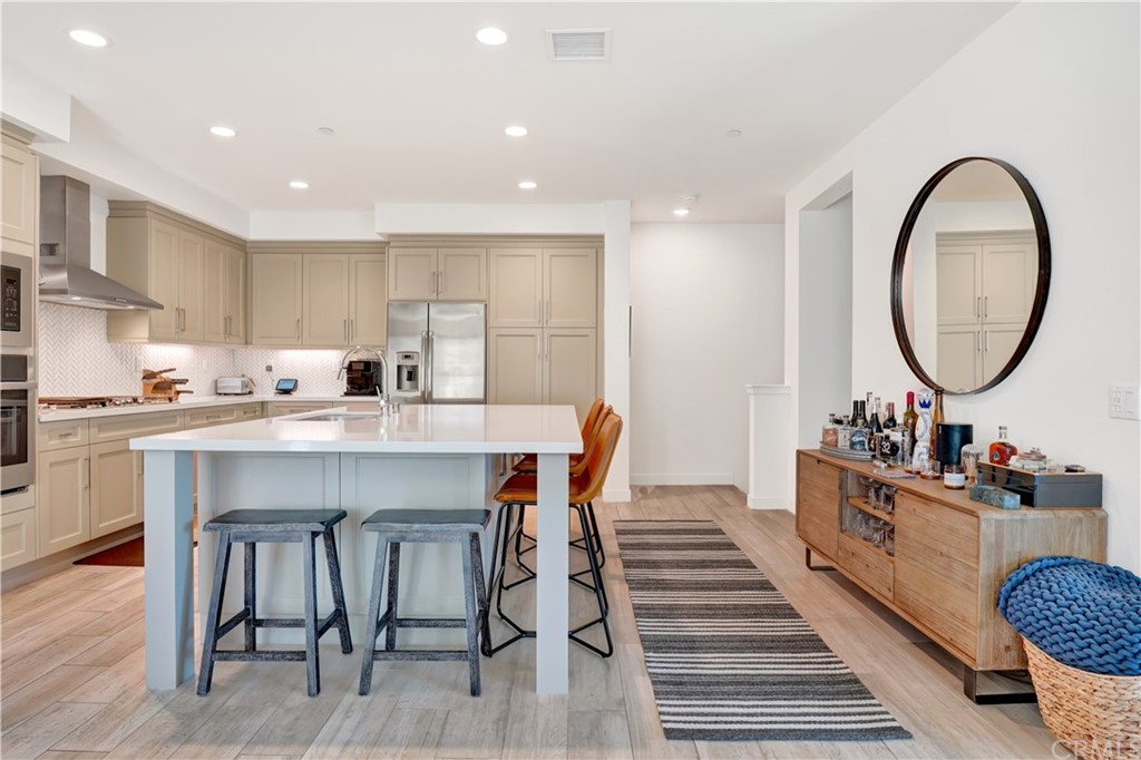 3197 Doheny Way Dana Point, CA 92629 - Photo 6 of 28 a kitchen with a table chairs sink and cabinets