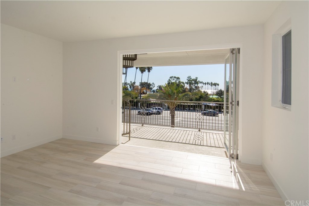 3197 Doheny Way Dana Point, CA 92629 - Photo 9 of 28 a view of a room with wooden floor and a floor to ceiling window