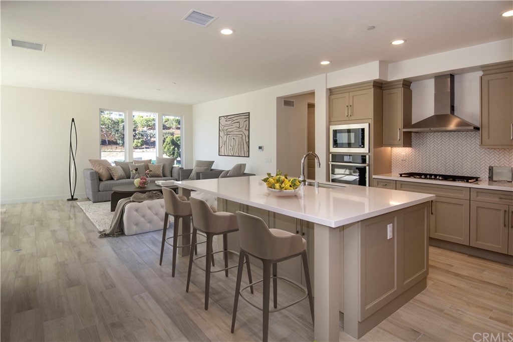 3197 Doheny Way Dana Point, CA 92629 - Photo 28 of 28 a kitchen with a table chairs refrigerator and cabinets