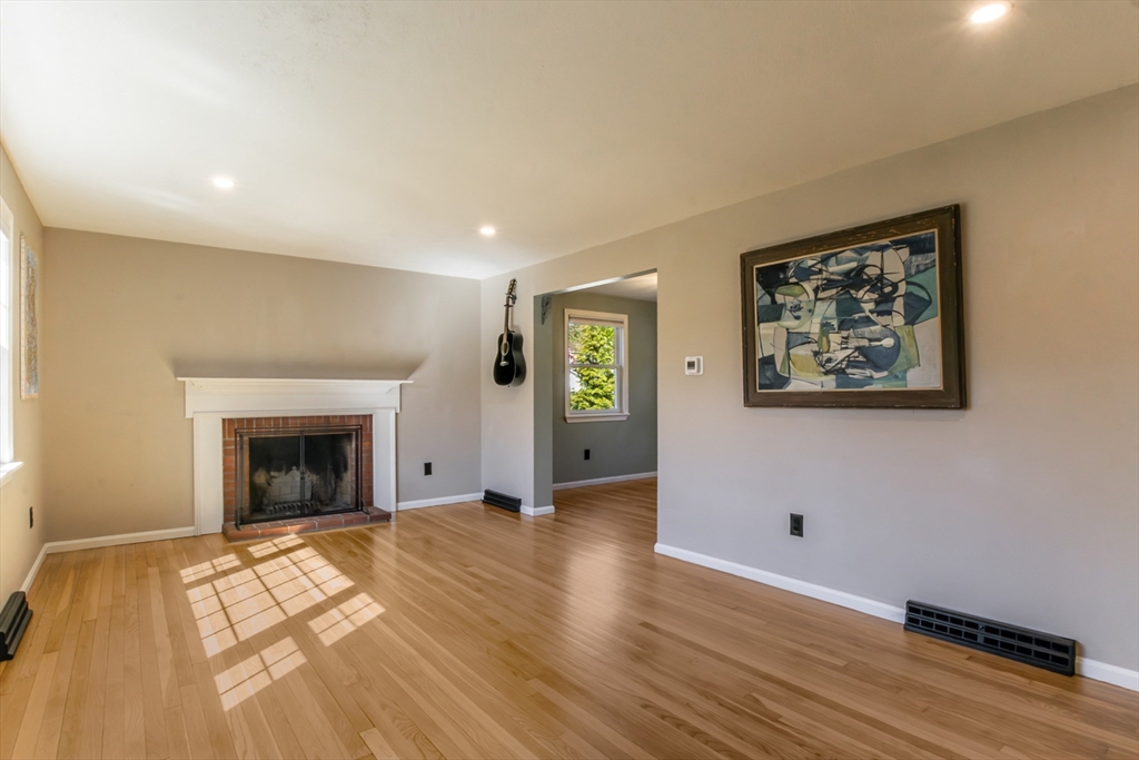 196 Center Street Groveland, MA 01834 - Photo 2 of 32 wooden floor fireplace and windows in an empty room