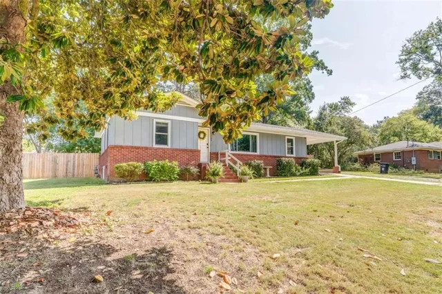 front view of a house with a yard