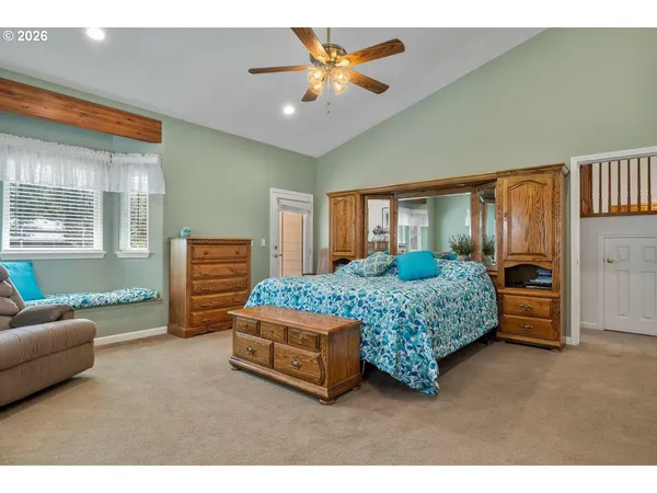 a bedroom with a bed and a couch