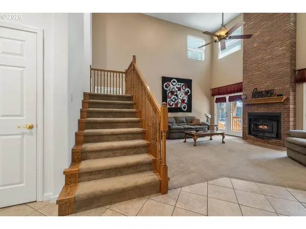 a view of a livingroom with furniture and a fireplace