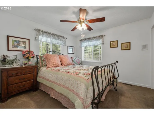 a bedroom with a bed and window