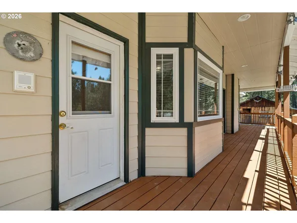 a view of a balcony with wooden floor