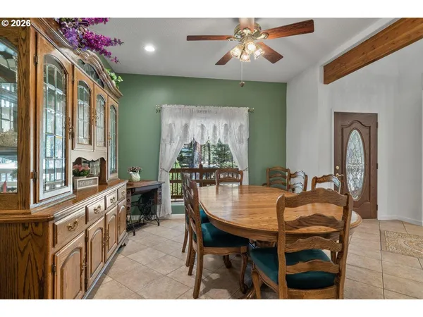 a dining room with furniture and window
