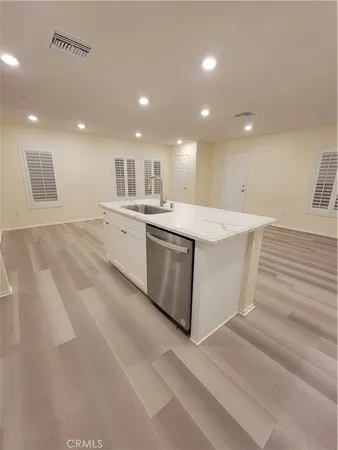 a view of kitchen with center island and stainless steel appliances