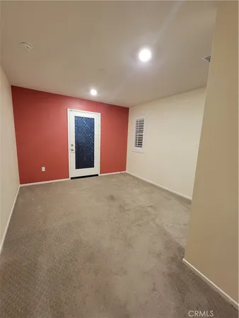 a view of an empty room with windows