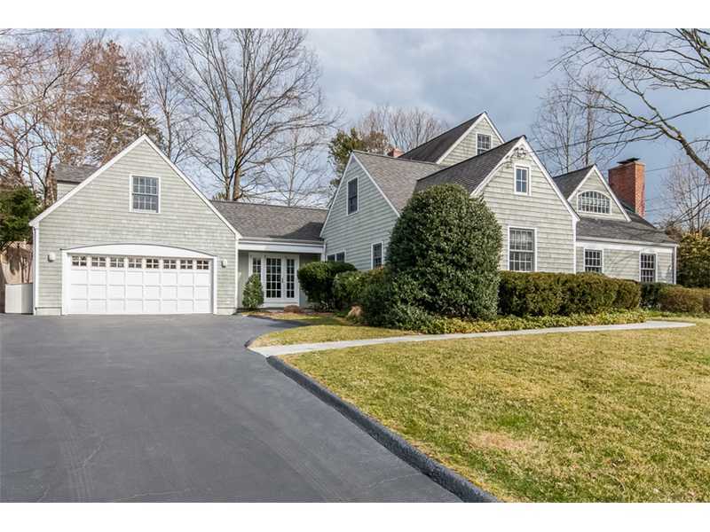5 Dorchester Lane Riverside, CT 06878 - Photo 2 of 22 a view of a house with a yard and garage