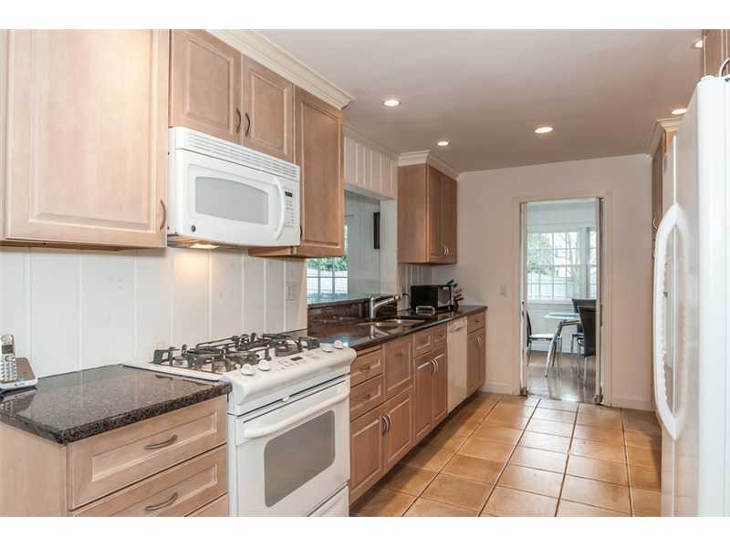 5 Dorchester Lane Riverside, CT 06878 - Photo 5 of 22 a kitchen with stainless steel appliances granite countertop a stove a sink and a microwave