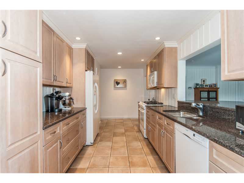 5 Dorchester Lane Riverside, CT 06878 - Photo 6 of 22 a kitchen with stainless steel appliances granite countertop a sink and cabinets
