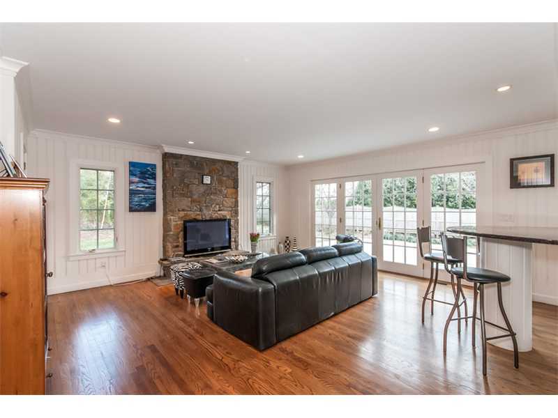 5 Dorchester Lane Riverside, CT 06878 - Photo 8 of 22 a living room with furniture wooden floor and a fireplace