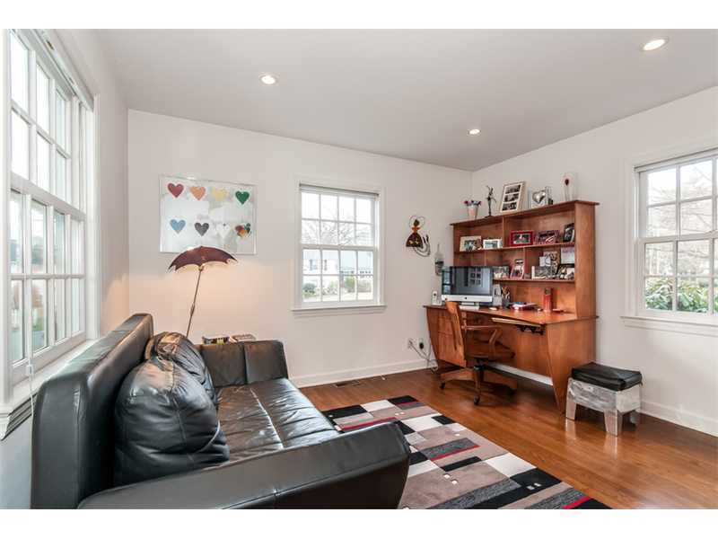 5 Dorchester Lane Riverside, CT 06878 - Photo 10 of 22 a living room with furniture a bookshelf and a window