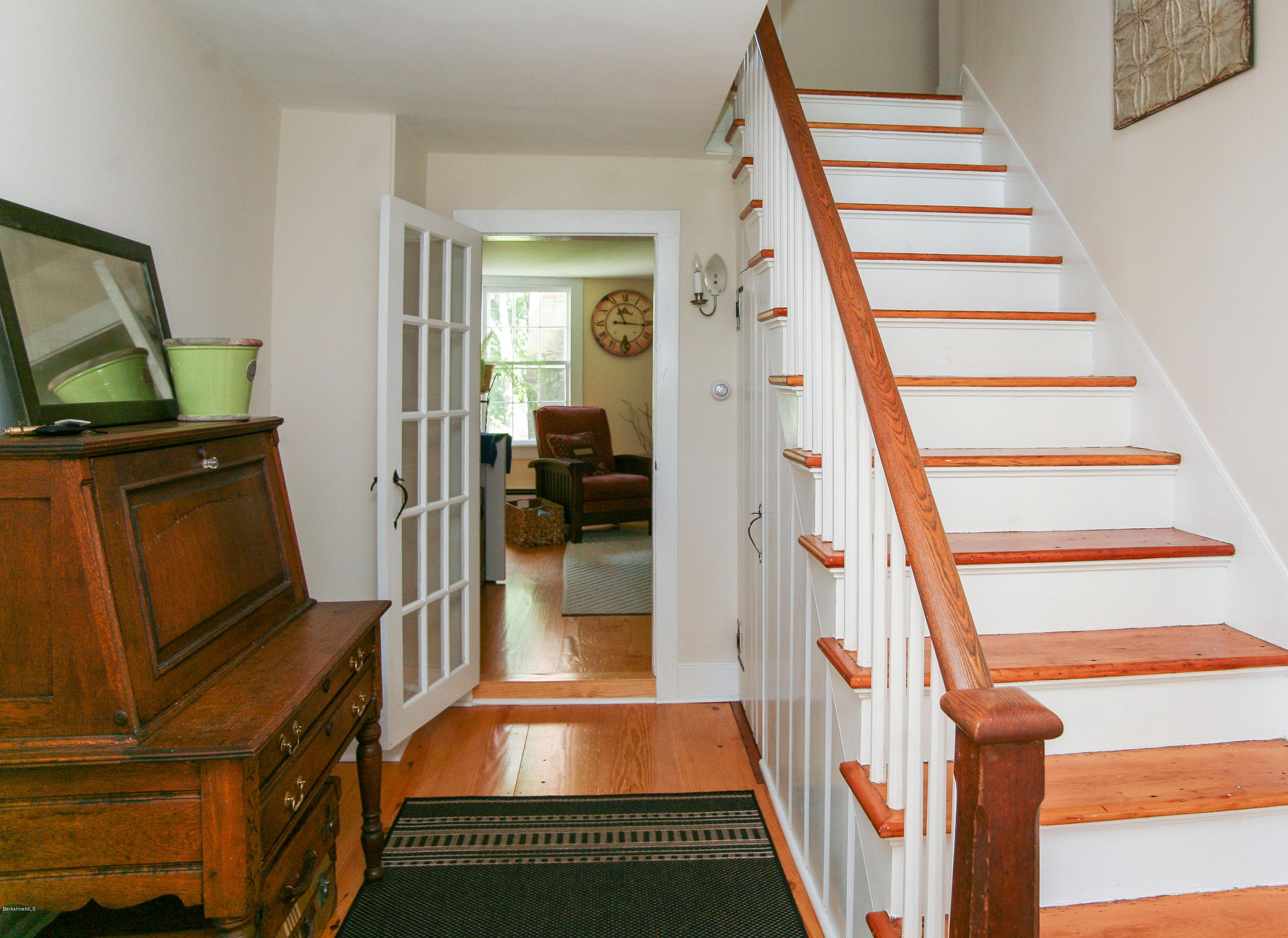 570 Devon Road Lee, MA 01238 - Photo 16 of 42 a view of a hallway with wooden floor and staircase