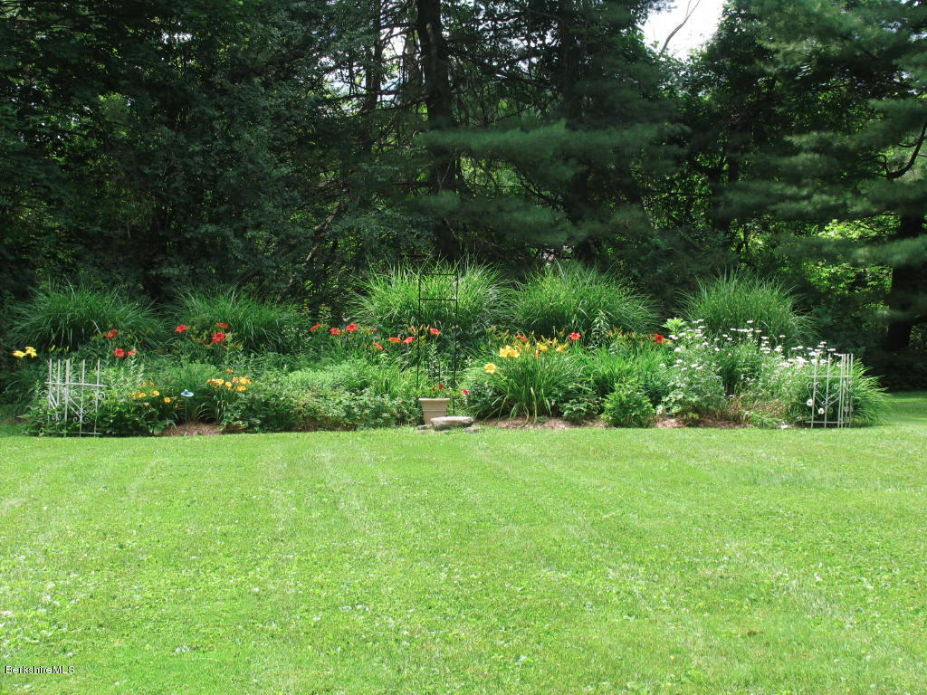 570 Devon Road Lee, MA 01238 - Photo 3 of 42 a view of a garden with a tree