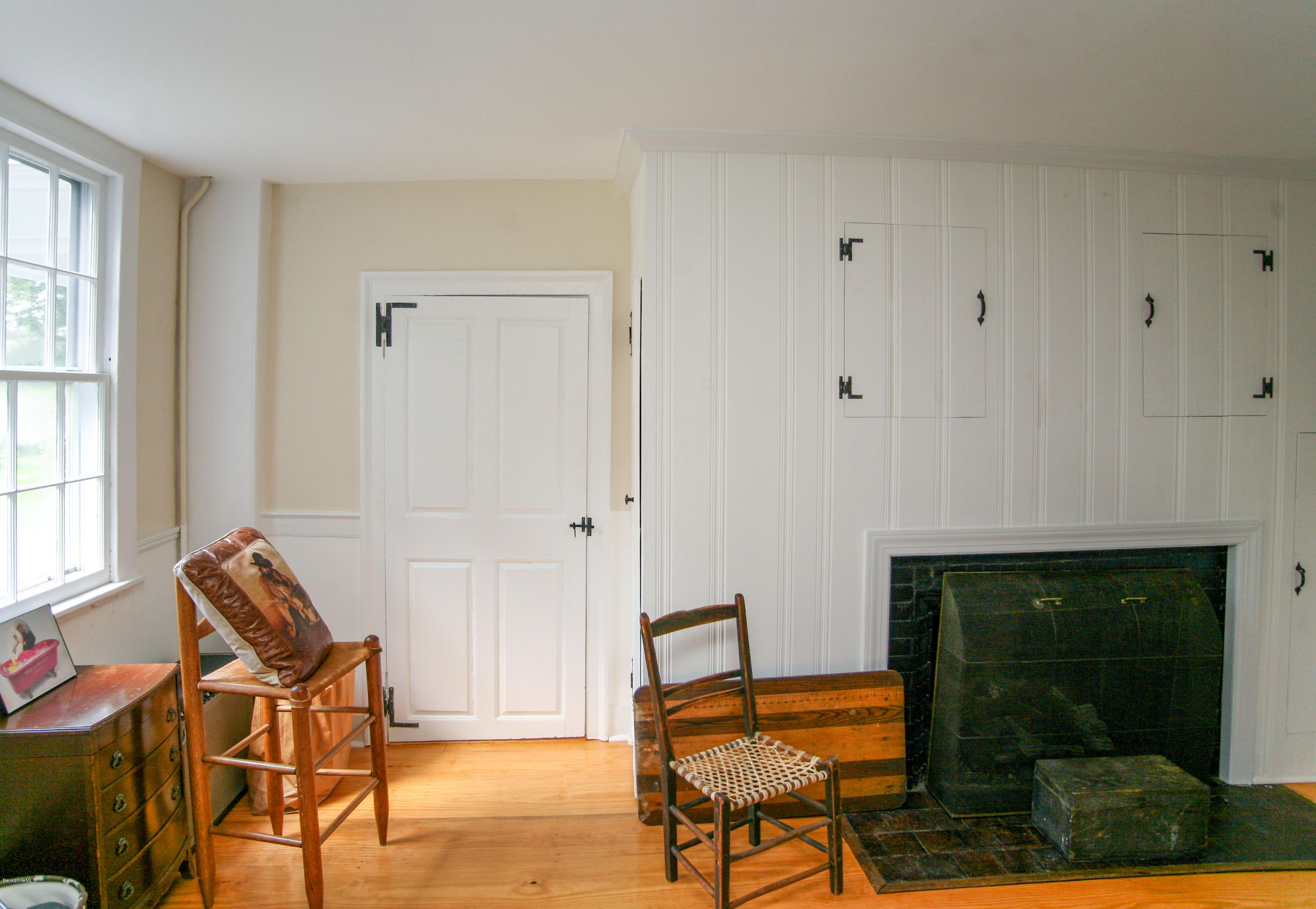 570 Devon Road Lee, MA 01238 - Photo 23 of 42 a bedroom with furniture and a fireplace