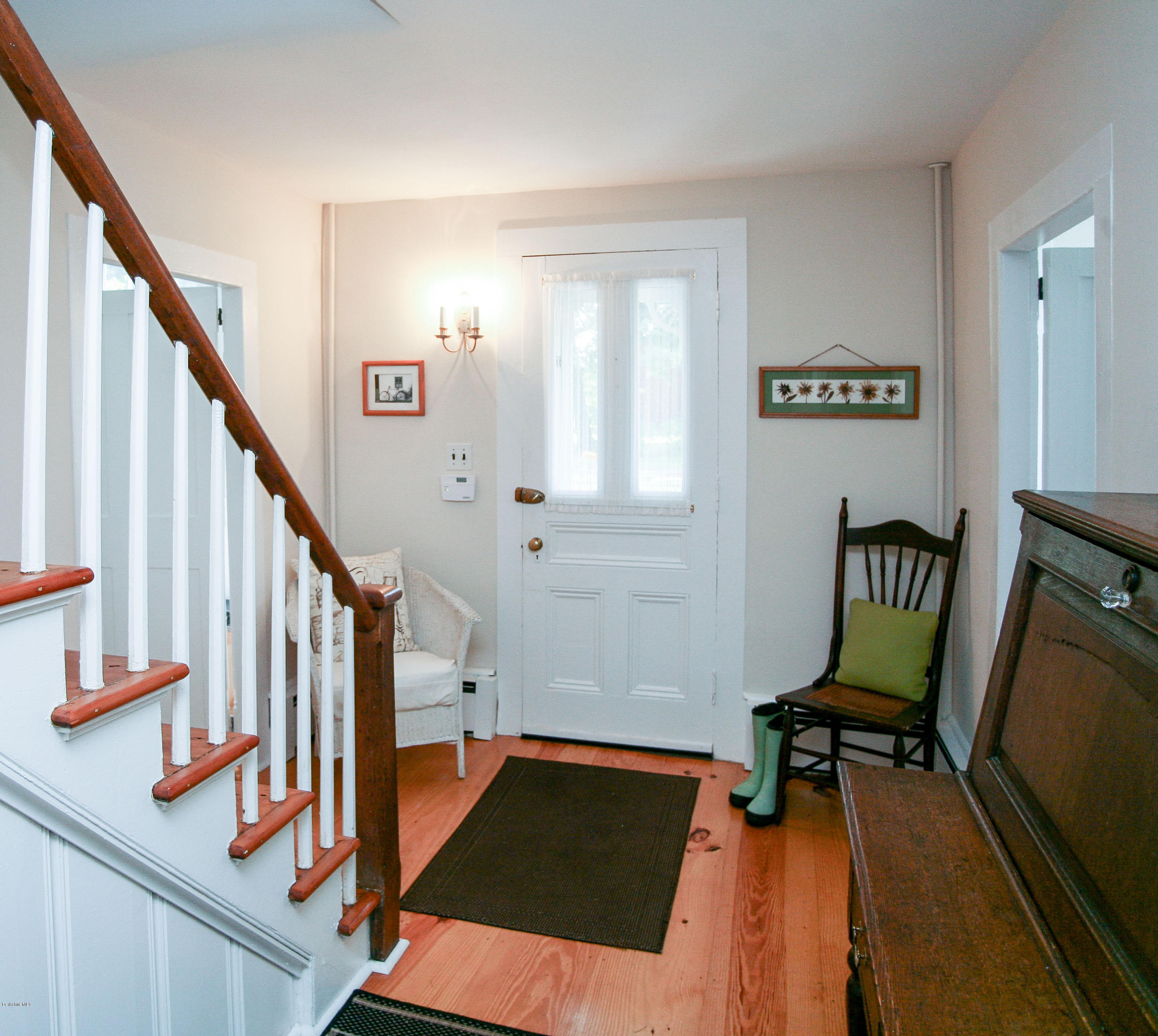 570 Devon Road Lee, MA 01238 - Photo 24 of 42 a view of a hallway with chairs and a workspace