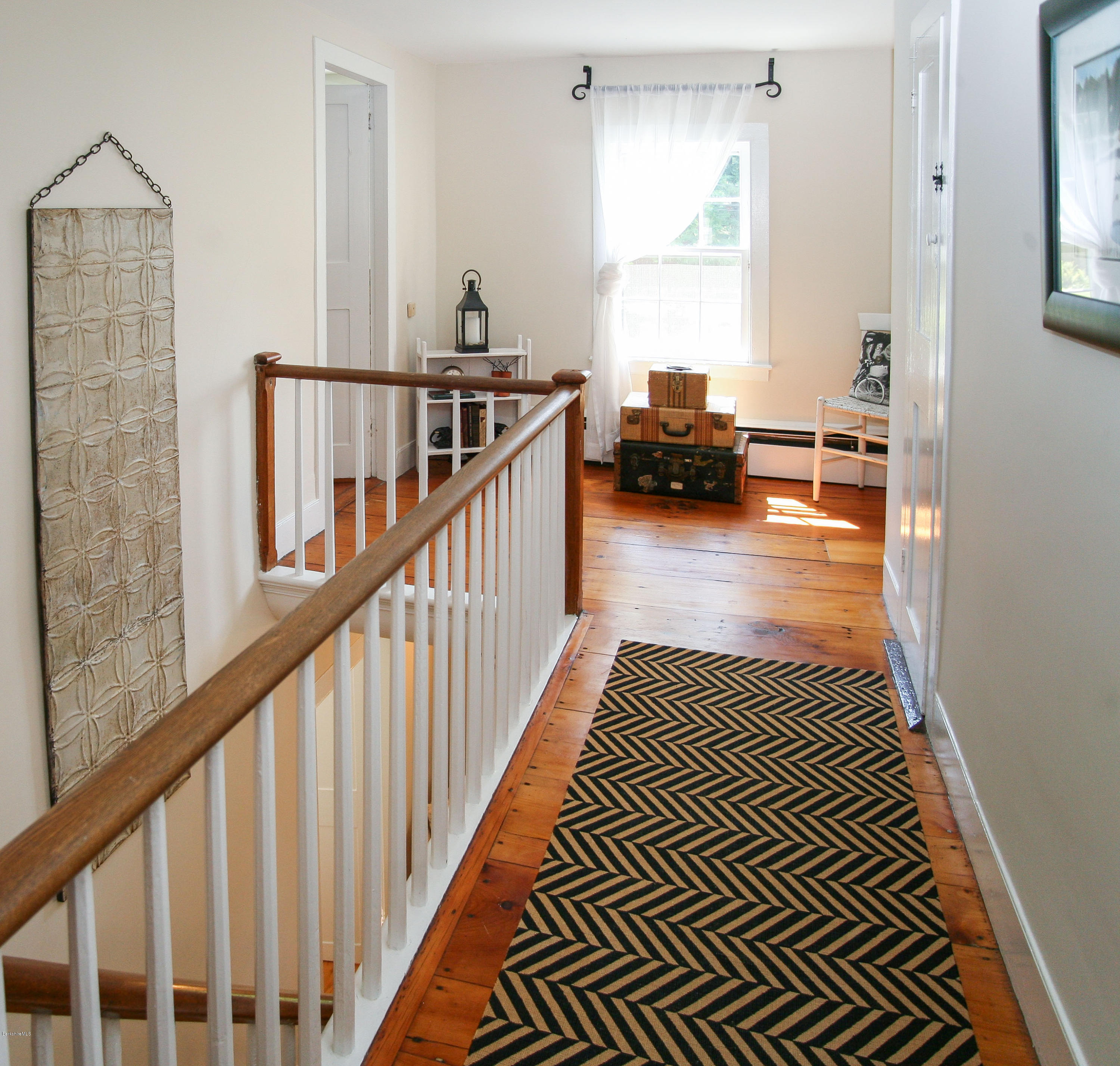 570 Devon Road Lee, MA 01238 - Photo 25 of 42 a view of a hallway with wooden floor and staircase