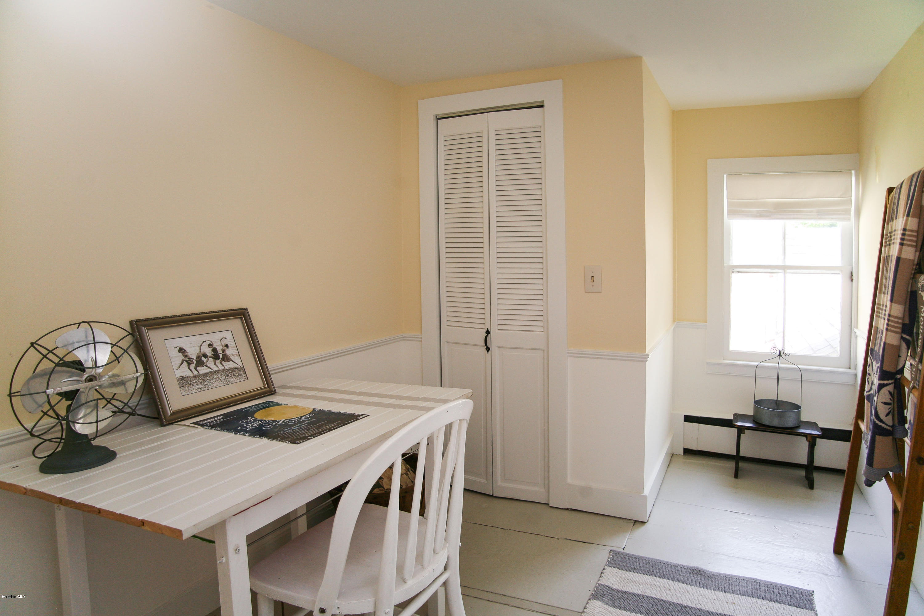 570 Devon Road Lee, MA 01238 - Photo 27 of 42 a view of a workspace with furniture and a window