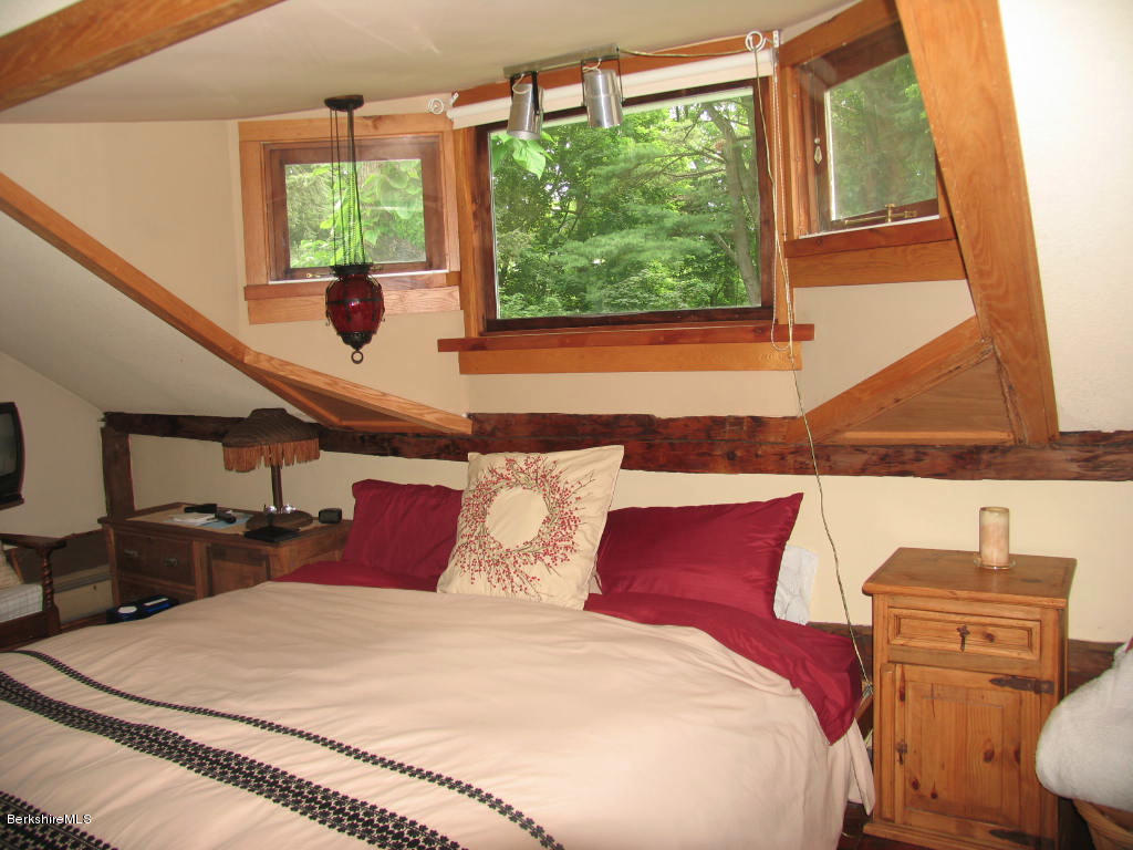 570 Devon Road Lee, MA 01238 - Photo 5 of 42 a bedroom with a bed and wooden floor