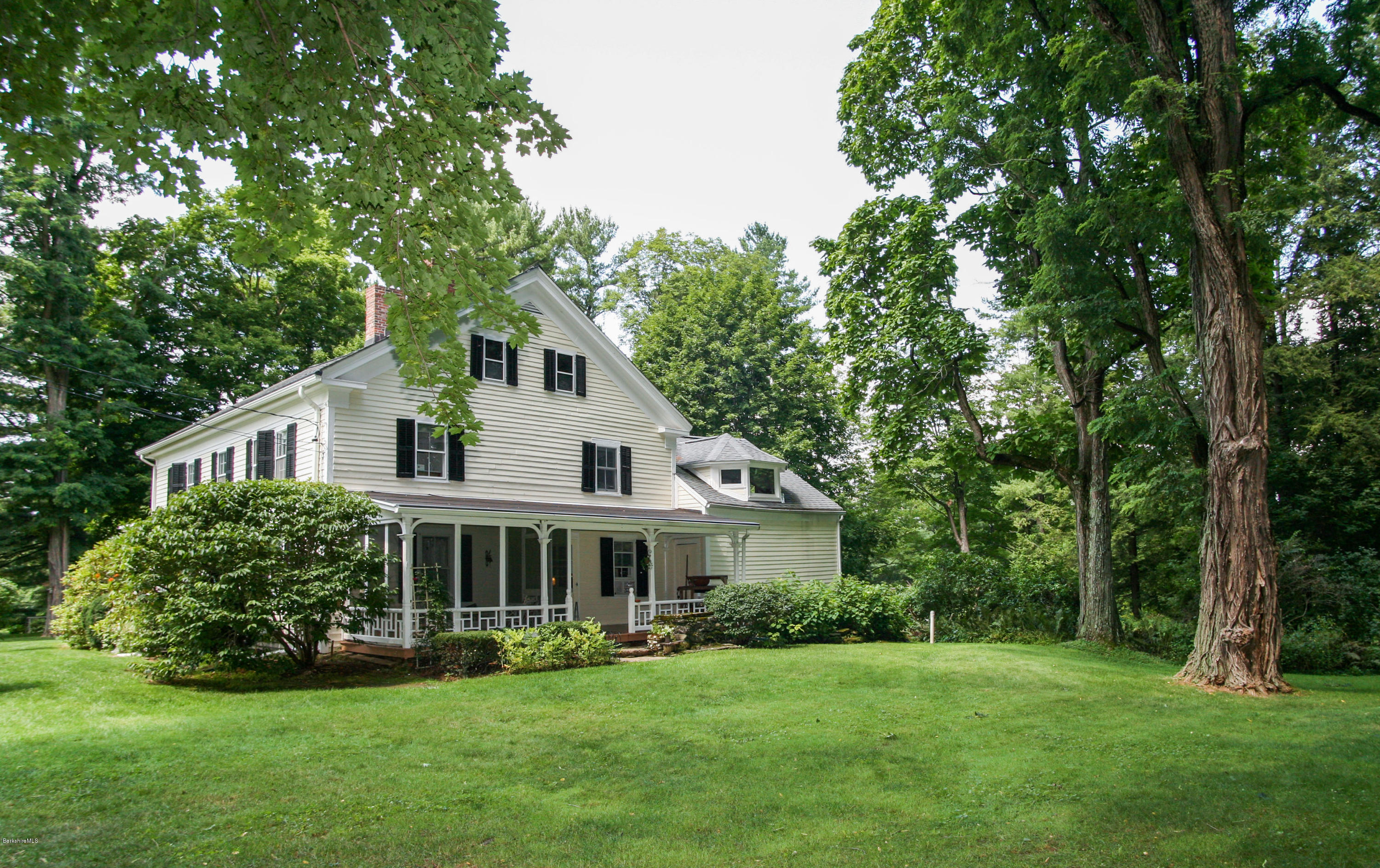 570 Devon Road Lee, MA 01238 - Photo 41 of 42 a front view of a house with a garden
