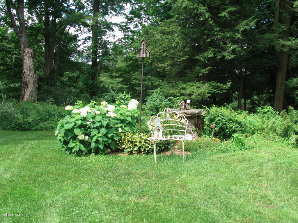 570 Devon Road Lee, MA 01238 - Photo 7 of 42 a view of a chair and table in the garden