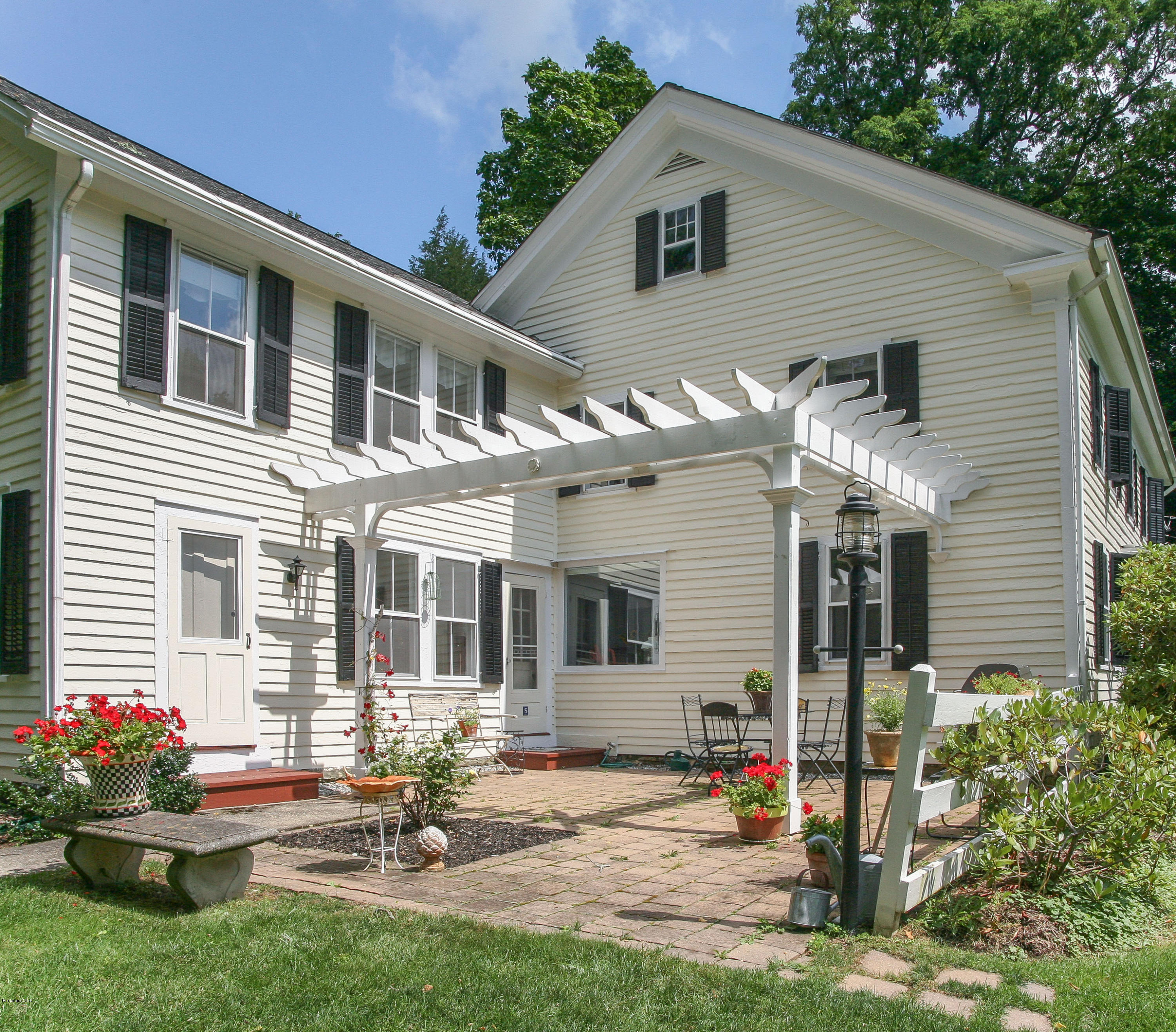 570 Devon Road Lee, MA 01238 - Photo 10 of 42 a backyard of a house with outdoor seating