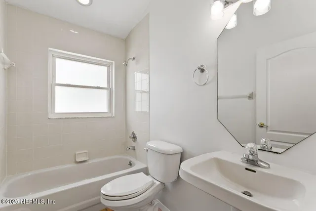 a view of an empty room with a flat screen tv