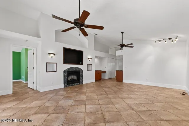 a view of an empty room with windows