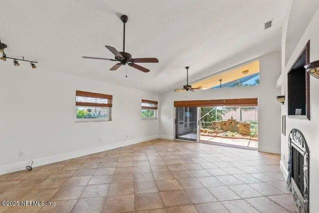 a spacious bathroom with a granite countertop sink mirror and a bathtub