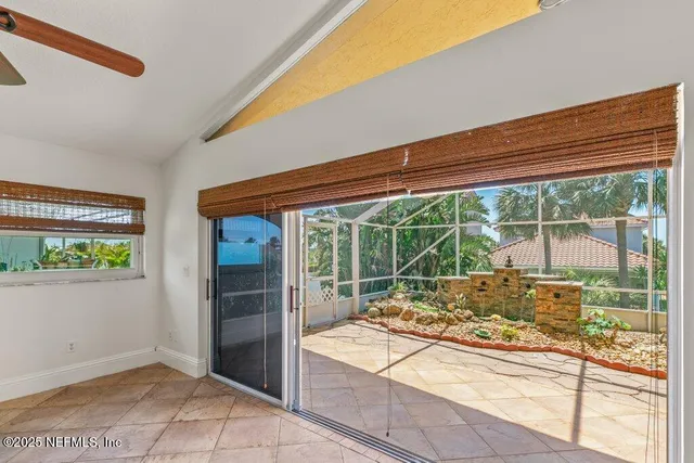 a white bath tub sitting next to a shower