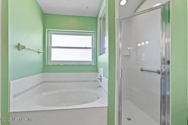 a room with lots of windows and glass door